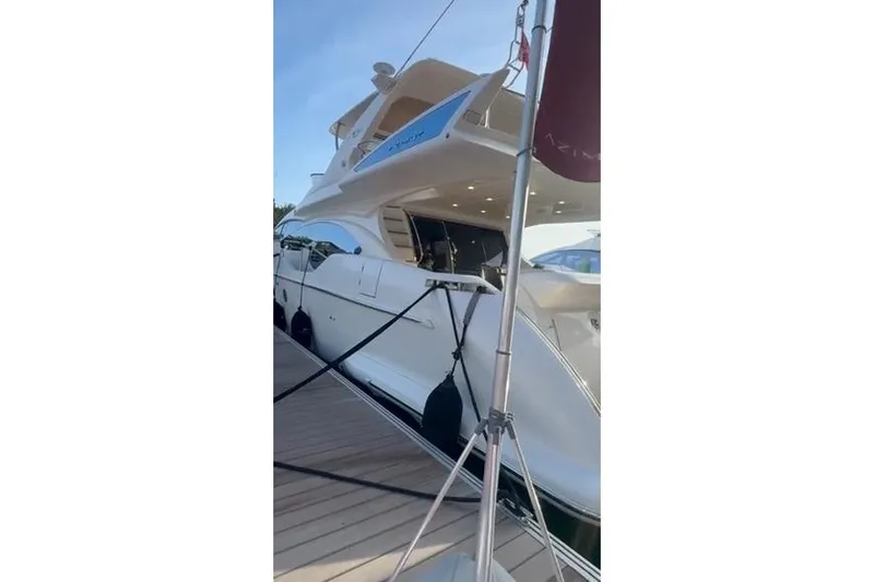  Yacht Photos Pics Luxury 2014 Azimut 70 yacht docked, showcasing sleek design and spacious deck.