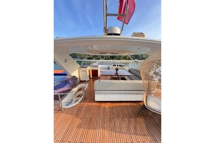  Yacht Photos Pics Luxurious 2014 Azimut 70 yacht deck with elegant seating and scenic water view.