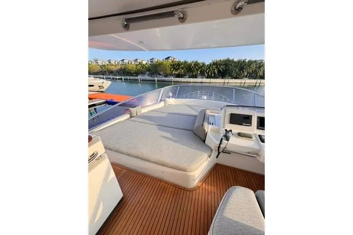  Yacht Photos Pics Luxurious 2014 Azimut 70 yacht deck with sunbed and scenic waterfront view.