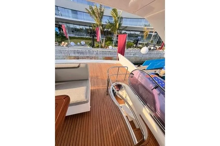  Yacht Photos Pics Luxurious 2014 Azimut 70 yacht deck with elegant seating and waterfront view.