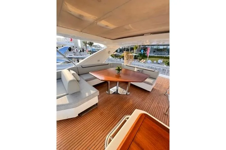  Yacht Photos Pics Luxurious 2014 Azimut 70 yacht deck with elegant seating and wooden table.