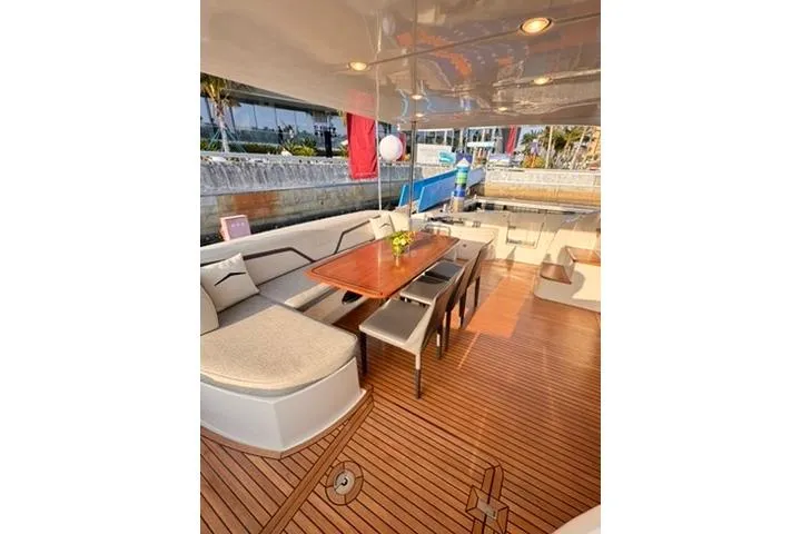  Yacht Photos Pics Luxurious 2014 Azimut 70 yacht deck with elegant seating and dining area.