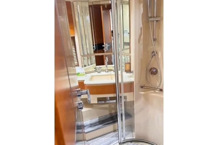  Yacht Photos Pics Luxurious bathroom in 2014 Azimut 70 yacht with modern shower and elegant fixtures.