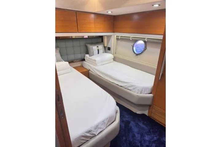  Yacht Photos Pics Twin cabin interior of 2014 Azimut 70 yacht with modern design and porthole window.