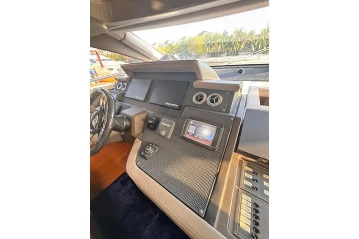  Yacht Photos Pics Cockpit of 2014 Azimut 70 yacht with modern navigation controls and steering wheel.