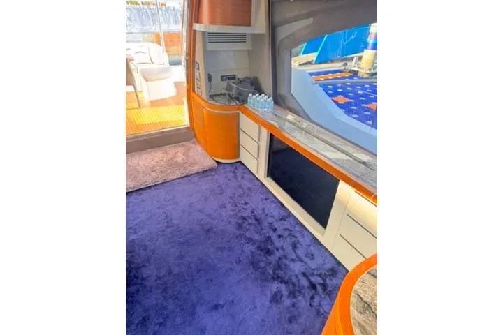  Yacht Photos Pics Luxurious interior of 2014 Azimut 70 yacht with plush purple carpet and modern amenities.