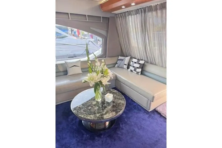 Yacht Photos Pics Luxurious interior of 2014 Azimut 70 yacht with elegant seating and floral centerpiece.