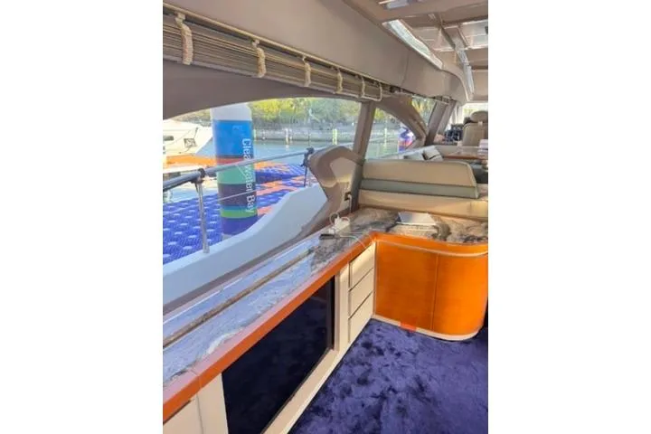  Yacht Photos Pics Luxurious interior of 2014 Azimut 70 yacht with elegant seating and panoramic windows.