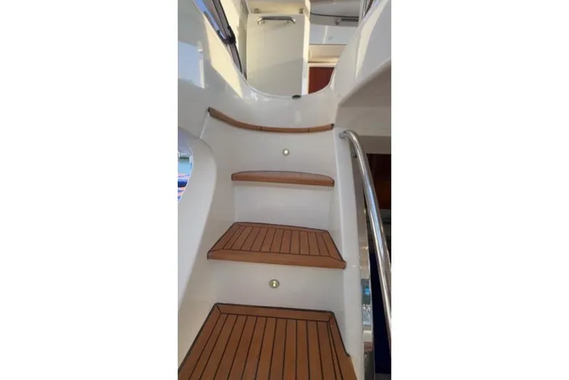  Yacht Photos Pics Staircase on 2014 Azimut 70 yacht with wooden steps and sleek design.