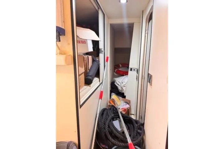  Yacht Photos Pics Interior of 2014 Azimut 70 yacht with storage items and cleaning equipment.