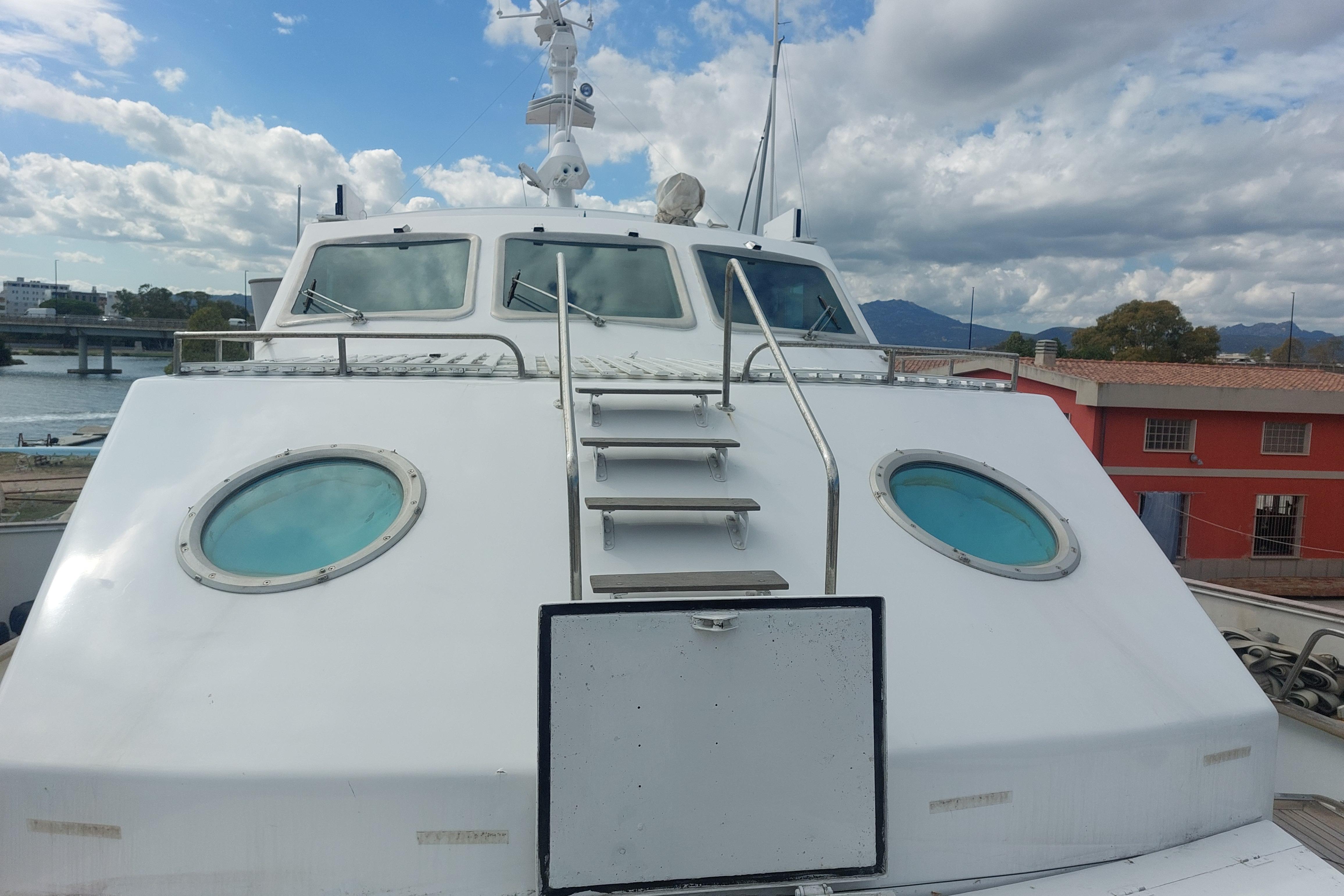 Codecasa 27m yacht, 1977 model, featuring a sleek white exterior with round windows.