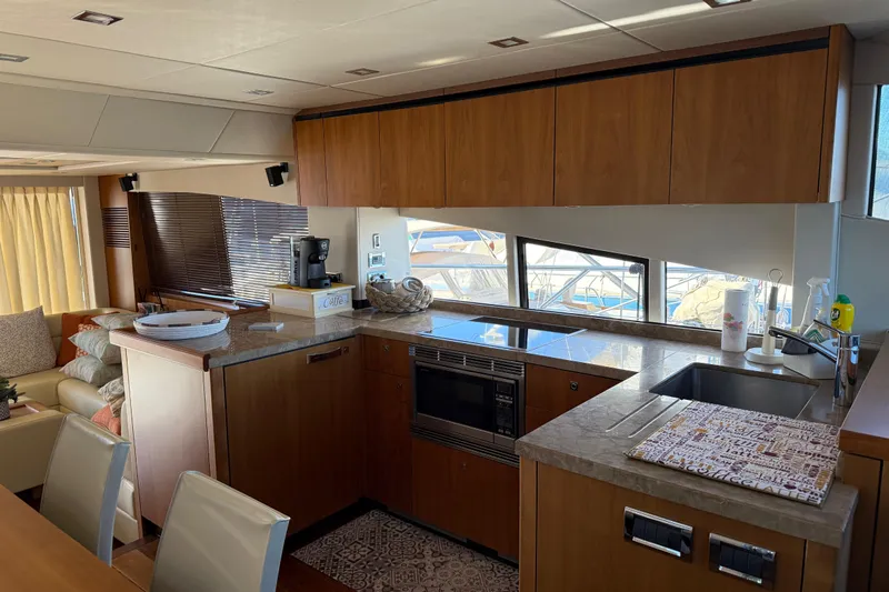 Thomas Yacht Photos Pics Luxurious kitchen interior of 2012 Sunseeker Manhattan 63 yacht with modern amenities.