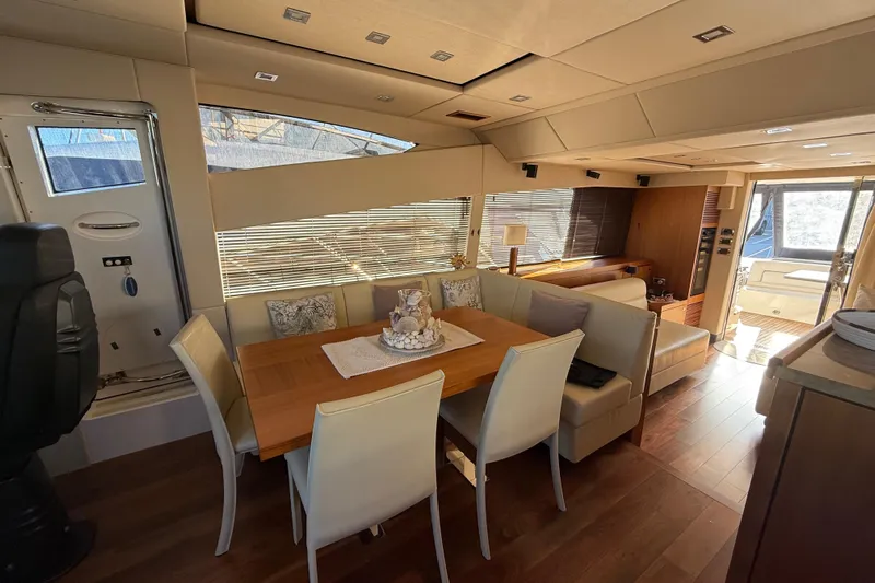 Thomas Yacht Photos Pics Luxurious interior of 2012 Sunseeker Manhattan 63 yacht with elegant dining area.