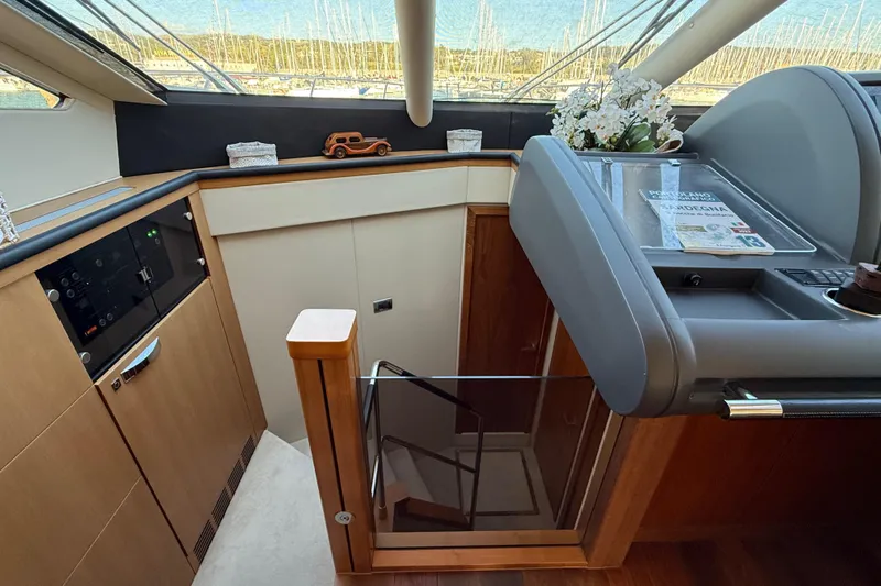 Thomas Yacht Photos Pics Interior of 2012 Sunseeker Manhattan 63 yacht, featuring modern design and elegant wood finishes.