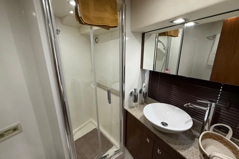 Thomas Yacht Photos Pics Luxurious bathroom in 2012 Sunseeker Manhattan 63 yacht with modern fixtures and shower.