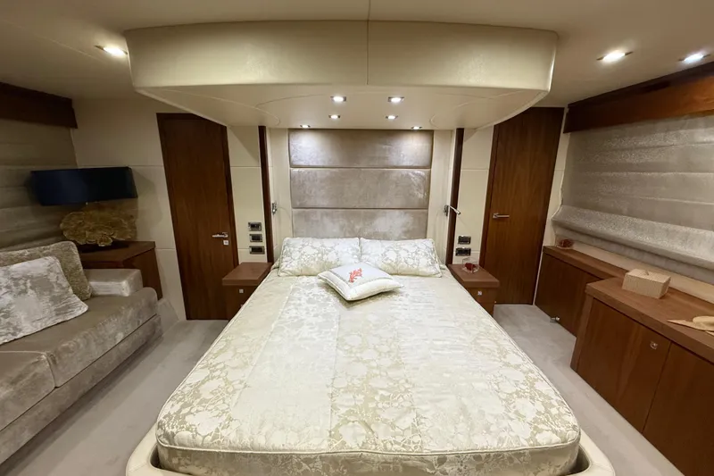 Thomas Yacht Photos Pics Luxurious bedroom interior of 2012 Sunseeker Manhattan 63 yacht with elegant decor.