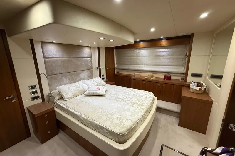 Thomas Yacht Photos Pics Luxurious bedroom interior of 2012 Sunseeker Manhattan 63 yacht with elegant decor.