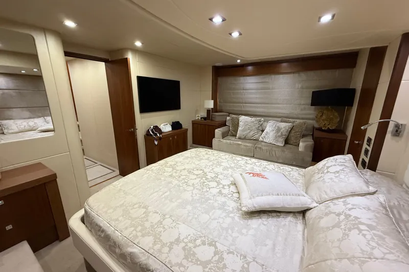 Thomas Yacht Photos Pics Luxurious interior of 2012 Sunseeker Manhattan 63 yacht with elegant bedroom and seating area.