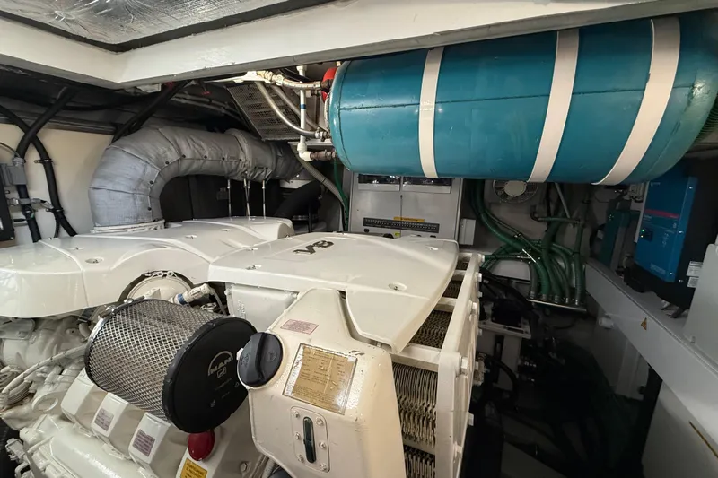 Thomas Yacht Photos Pics Engine room of 2012 Sunseeker Manhattan 63 yacht, featuring mechanical components and piping.