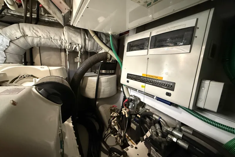 Thomas Yacht Photos Pics Engine room of 2012 Sunseeker Manhattan 63 yacht, featuring control panels and machinery.