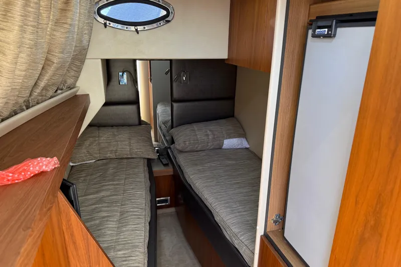 Thomas Yacht Photos Pics Cozy twin cabin interior of 2012 Sunseeker Manhattan 63 yacht with modern wood finishes.