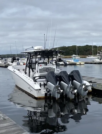  Yacht Photos Pics Fountain 38 Tournament Edition 2021 with triple outboard engines in harbor.