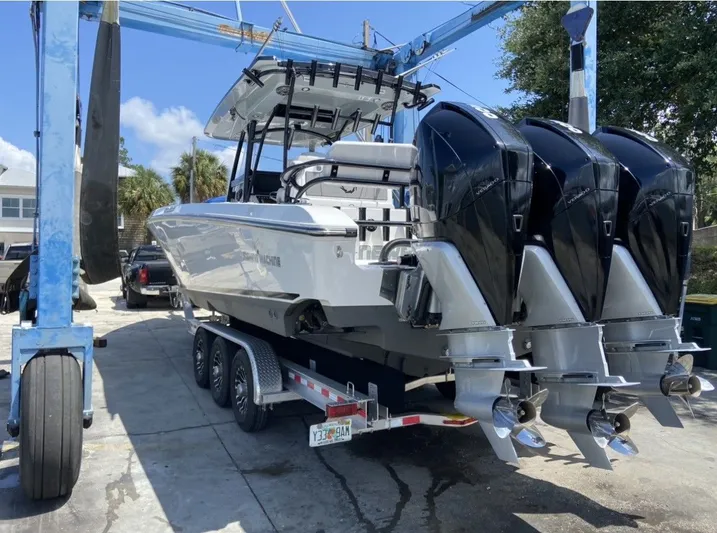  Yacht Photos Pics 2021 Fountain 38 Tournament Edition boat on trailer with triple engines.