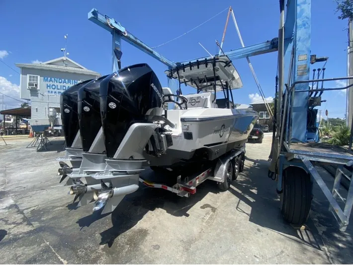  Yacht Photos Pics 2021 Fountain 38 Tournament Edition boat on trailer at harbor.