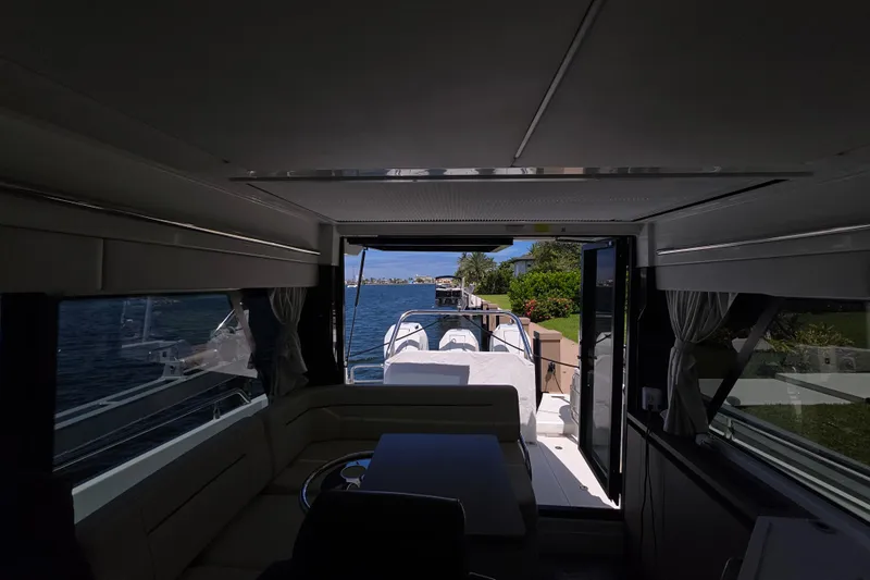  Yacht Photos Pics Interior view of 2024 Wellcraft 355 Commuter yacht, showcasing sleek design and waterfront scenery.