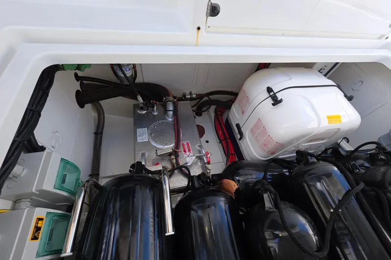  Yacht Photos Pics 2024 Wellcraft 355 Commuter engine compartment with equipment and storage components.