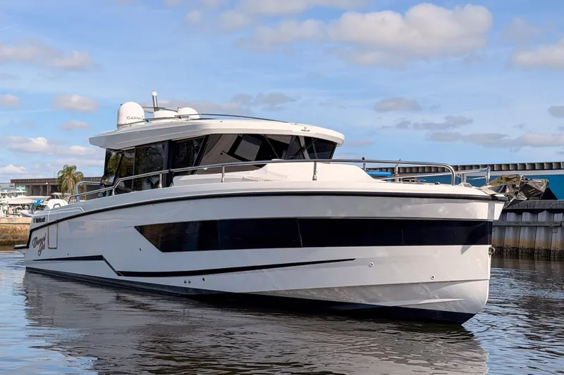  Yacht Photos Pics 2024 Wellcraft 355 Commuter boat on water, showcasing sleek design and modern features.