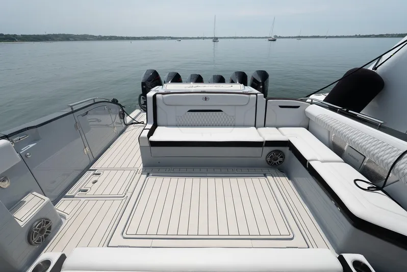  Yacht Photos Pics Luxurious 2025 Cigarette 52 Thunder yacht deck with sleek seating and powerful engines.