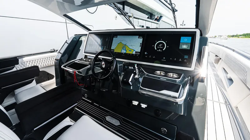  Yacht Photos Pics Helm of 2025 Cigarette 52 Thunder yacht with advanced navigation displays and controls.