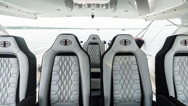  Yacht Photos Pics Luxury seating on 2025 Cigarette 52 Thunder boat, featuring sleek design and premium materials.
