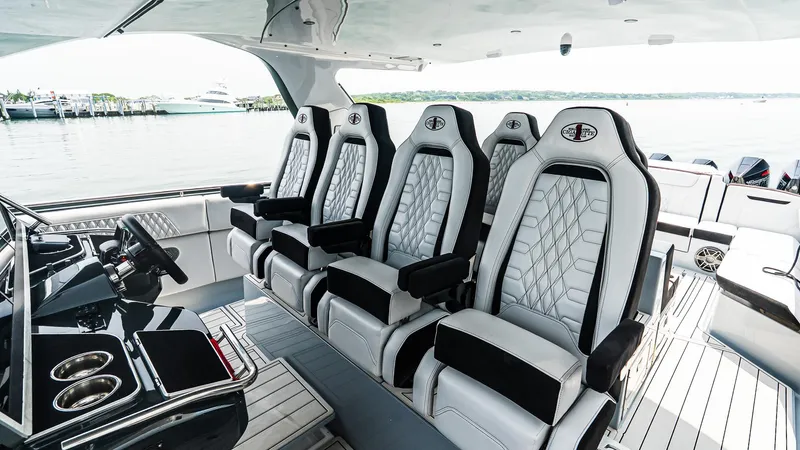  Yacht Photos Pics Luxury interior of 2025 Cigarette 52 Thunder boat with plush seating and sleek design.