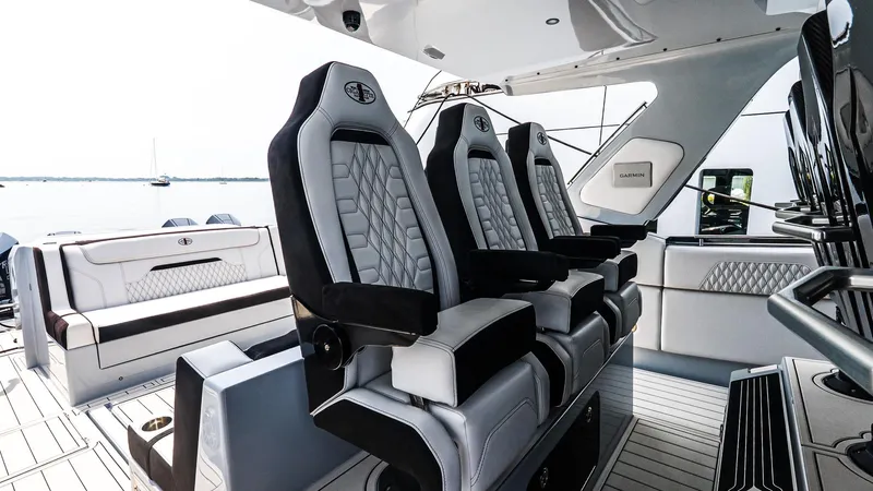 Yacht Photos Pics Luxurious interior of 2025 Cigarette 52 Thunder boat with plush seating and modern design.