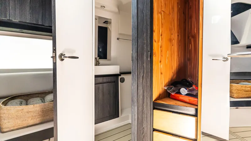  Yacht Photos Pics Interior of 2025 Cigarette 52 Thunder boat featuring modern cabinetry and storage.