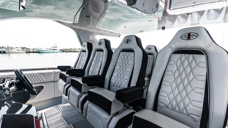  Yacht Photos Pics Luxurious interior seating of 2025 Cigarette 52 Thunder boat with diamond-stitched upholstery.