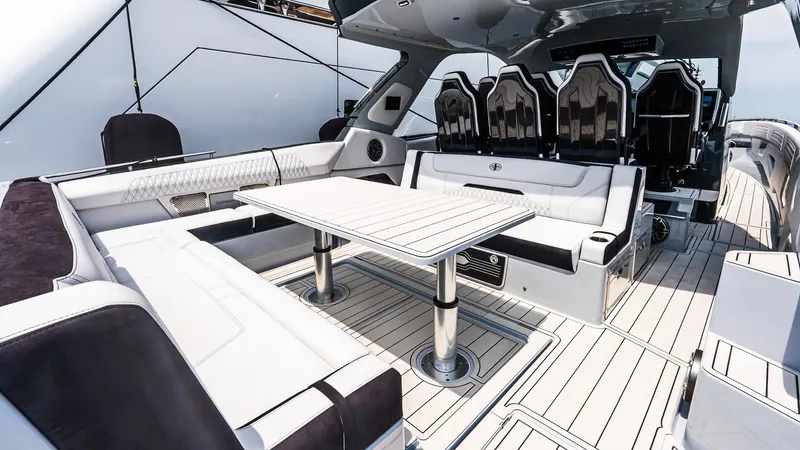  Yacht Photos Pics Luxurious interior of 2025 Cigarette 52 Thunder boat with sleek seating and modern design.