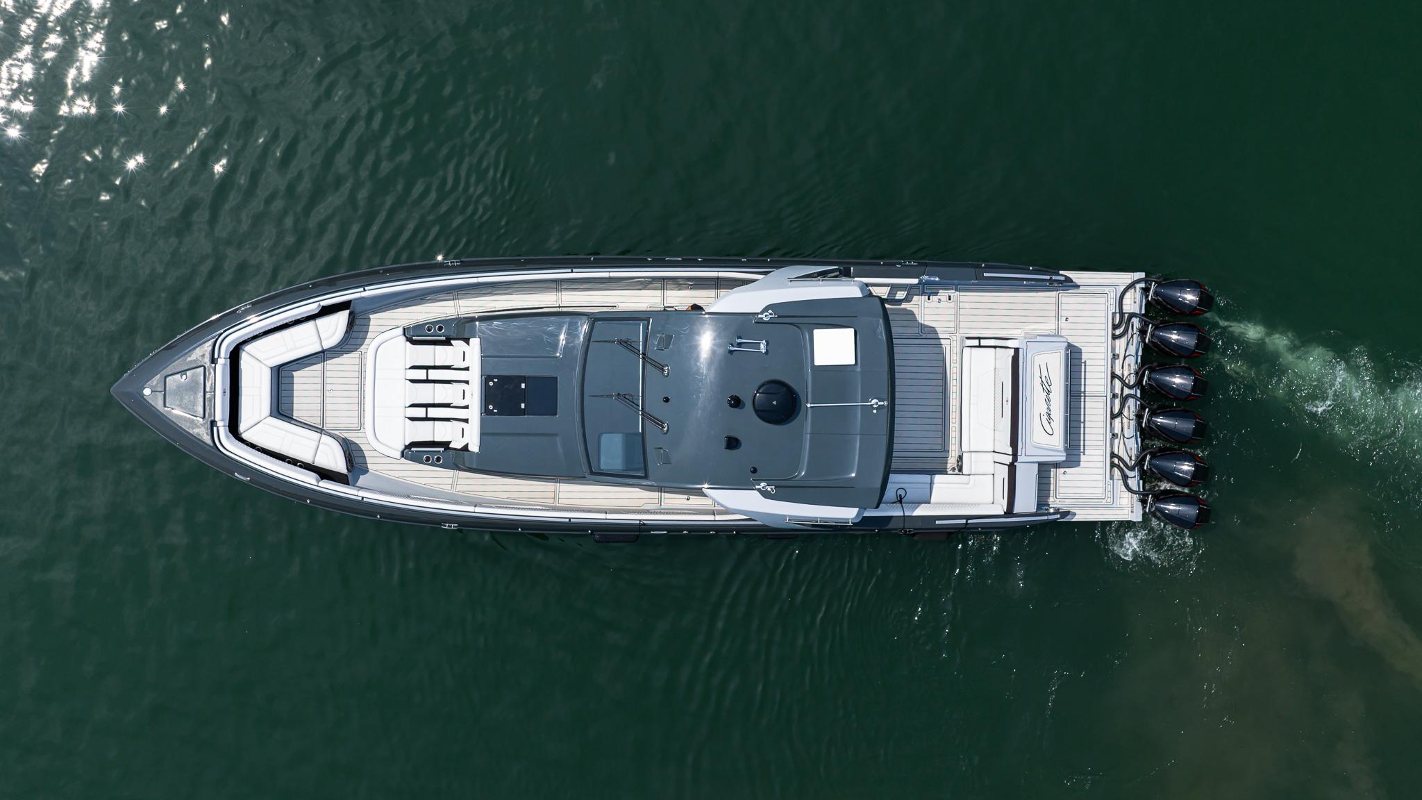 Aerial view of 2025 Cigarette 52 Thunder boat cruising on water.