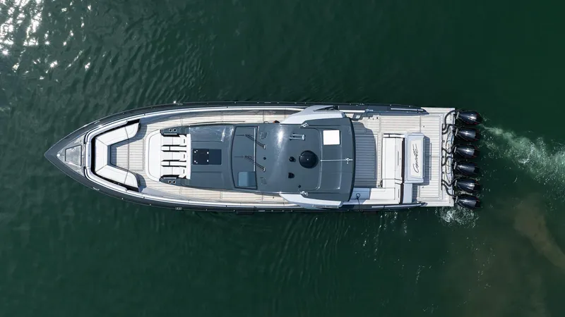  Yacht Photos Pics Aerial view of 2025 Cigarette 52 Thunder boat cruising on water.