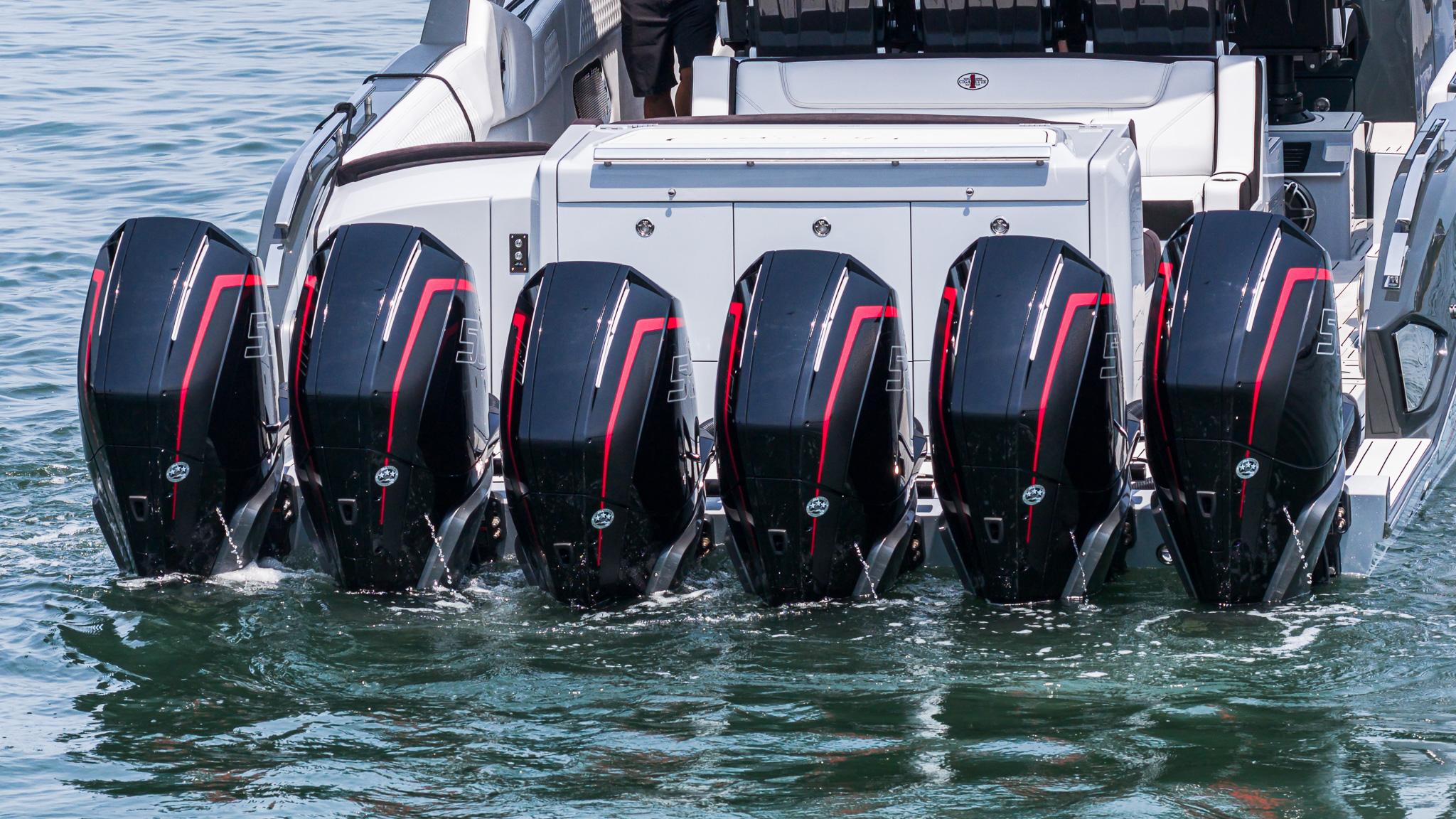 2025 Cigarette 52 Thunder boat with six powerful outboard engines on water.