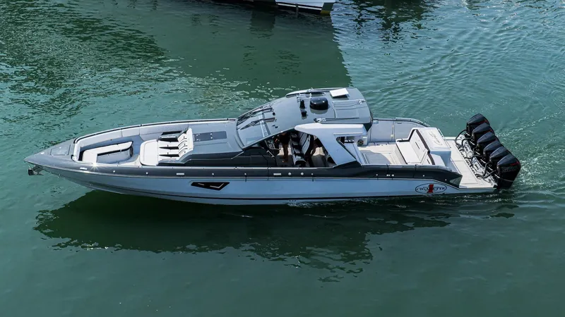  Yacht Photos Pics 2025 Cigarette 52 Thunder boat cruising on water, showcasing sleek design and powerful engines.
