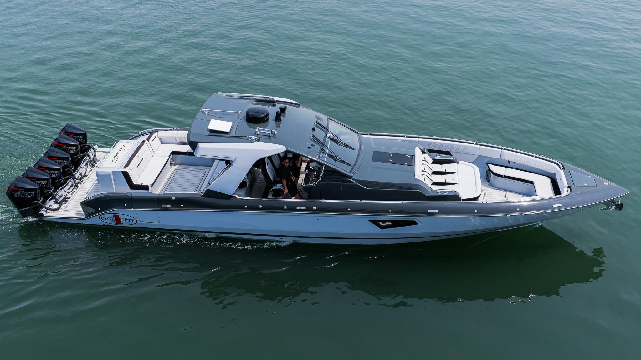 2025 Cigarette 52 Thunder boat cruising on calm water, showcasing sleek design and powerful engines.