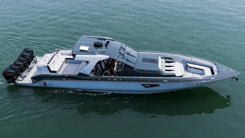  Yacht Photos Pics 2025 Cigarette 52 Thunder boat cruising on calm water, showcasing sleek design and powerful engines.
