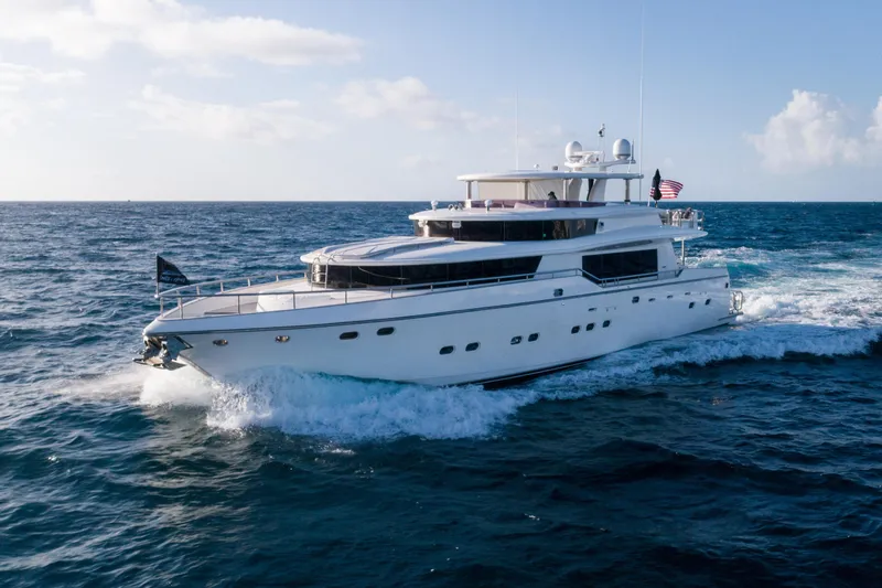 Aleniel Yacht Photos Pics Luxurious 2005 Johnson 87' Motor Yacht cruising on open sea.