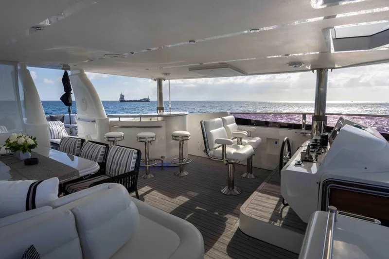 Aleniel Yacht Photos Pics Luxurious 2005 Johnson 87' Motor Yacht interior with ocean view and elegant seating.