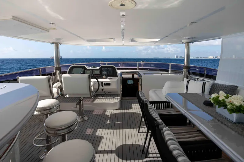 Aleniel Yacht Photos Pics Luxurious 2005 Johnson 87' Motor Yacht interior with elegant seating and ocean view.