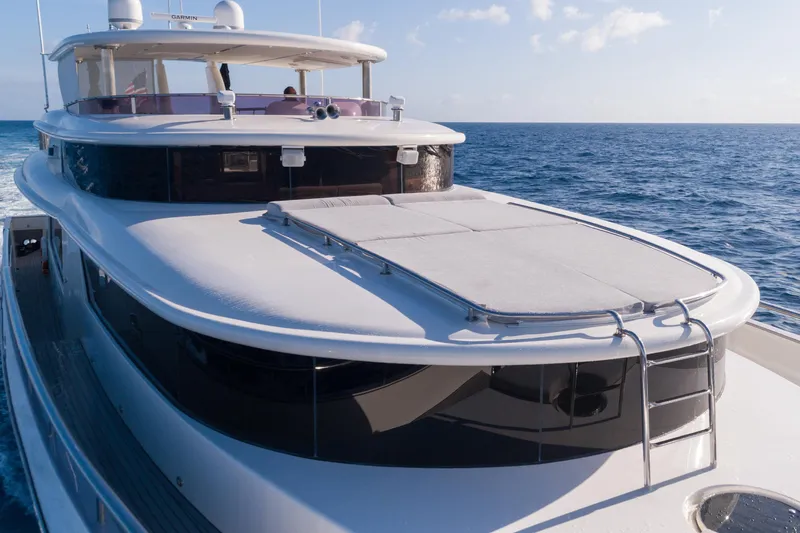 Aleniel Yacht Photos Pics Luxurious 2005 Johnson 87' Motor Yacht cruising on open sea.