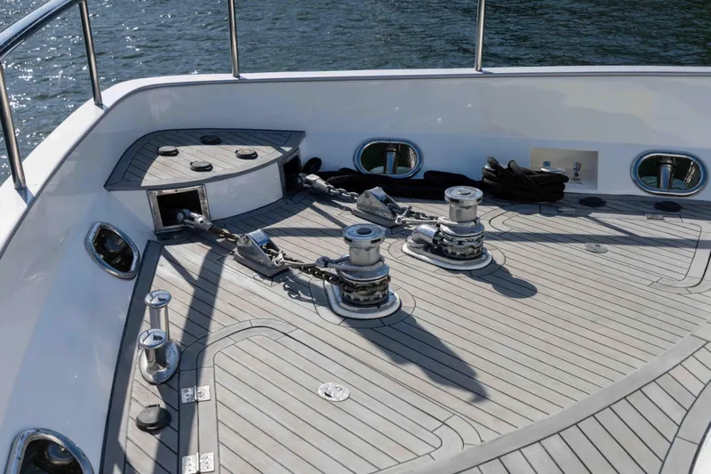 Aleniel Yacht Photos Pics Deck of 2005 Johnson 87' Motor Yacht with anchor chains and winches.